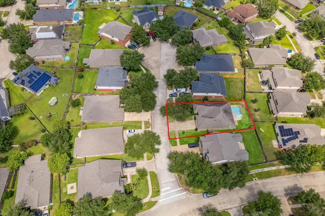 an aerial view of residential house with outdoor space and parking
