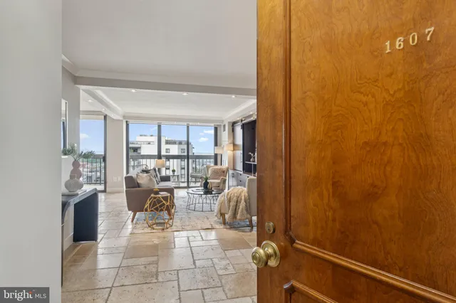 a very nice looking room with a large window and chairs