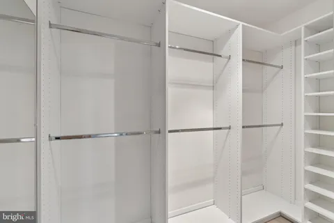 a view of an empty walk in closet