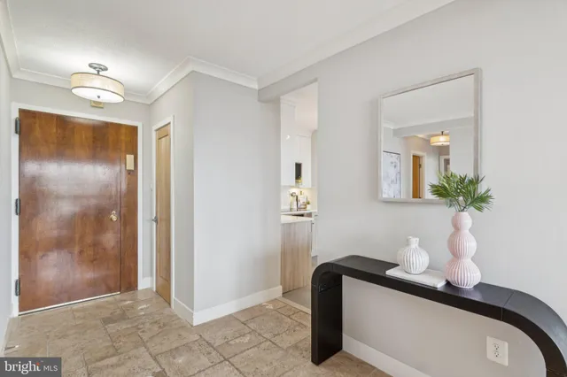 a bathroom with a sink a light fixture and a mirror
