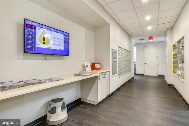 a view of a patio with a table and chairs next to a yard