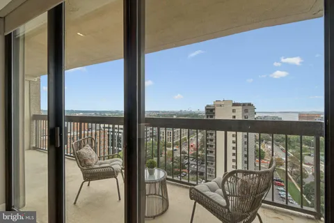 a view of a balcony with wooden floor