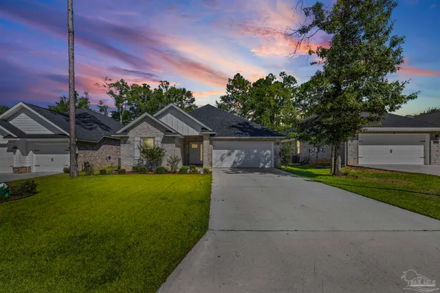 a front view of a house with garden