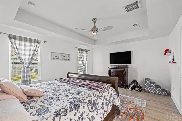 a en suite bathroom with double sink and a mirror