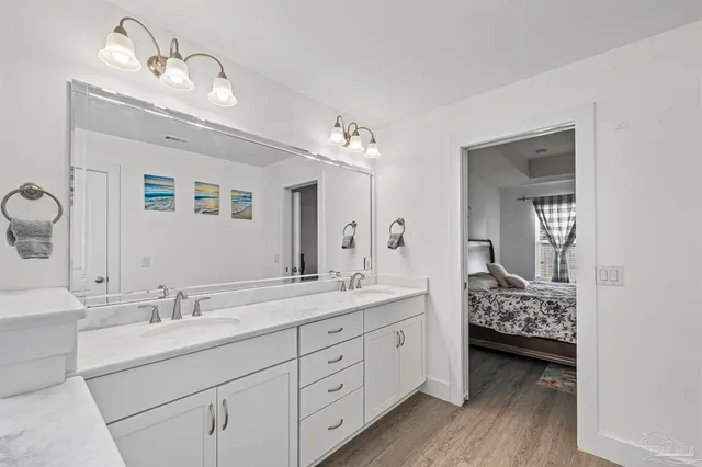 a bathroom with a sink a mirror and a bathtub