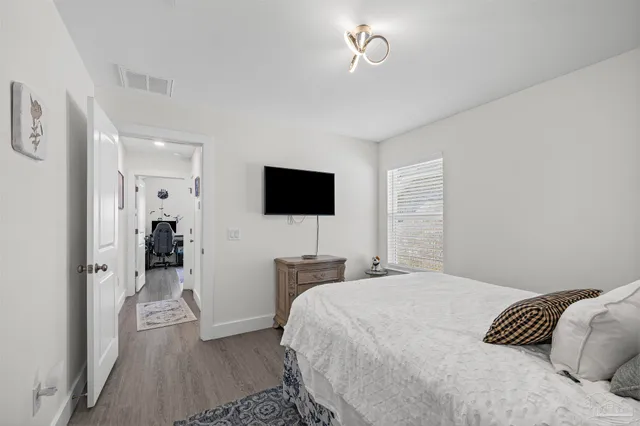 a bedroom with furniture and a window