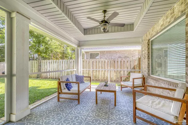a living room with furniture and a window