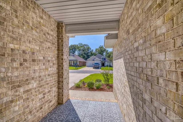 a bedroom with furniture and wooden floor