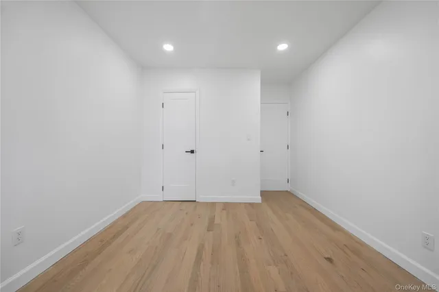 a view of an empty room with a cabinet