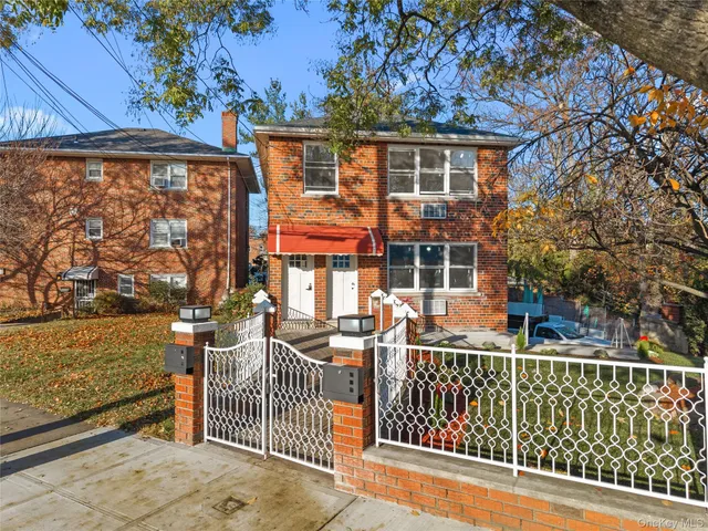 a view of a brick house with a large window