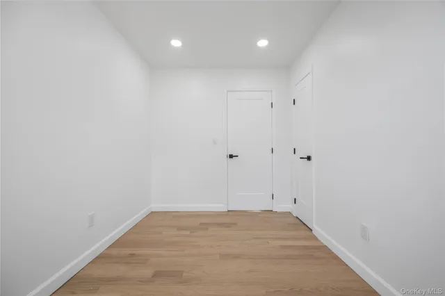 a view of room with wooden floor and window