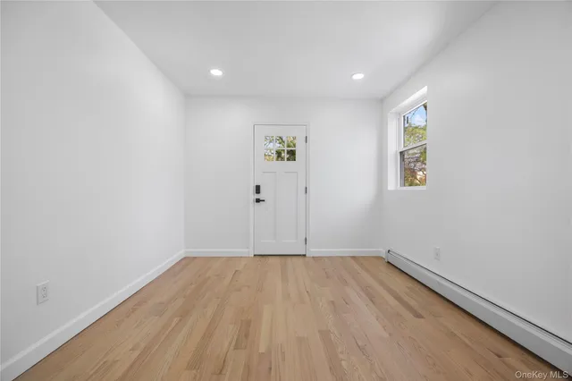 a view of room with wooden floor