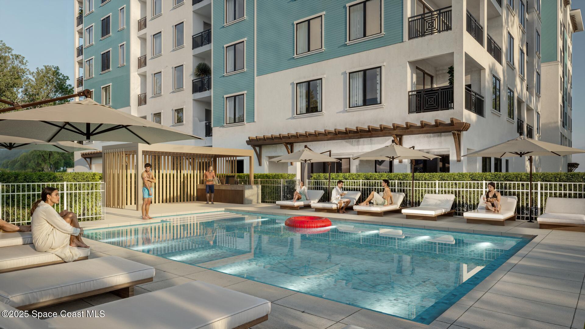 1230 Jimmy Buffett Mem Highway, Unit 410 Satellite Beach, FL 32937 - Photo 5 of 14 a view of a building with sitting area