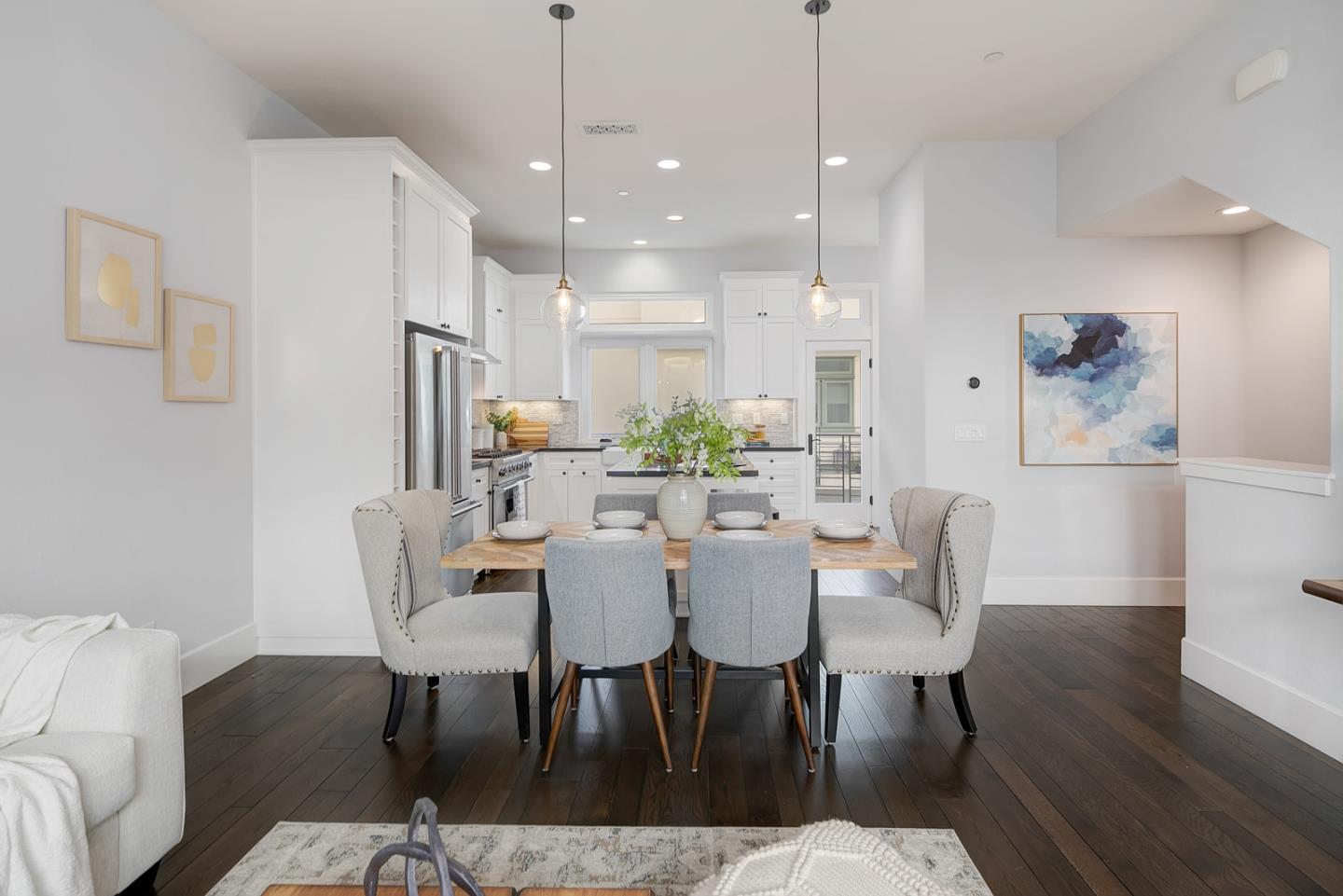 534 Fierro Loop Campbell, CA 95008 - Photo 15 of 55 a view of a dining room with furniture wooden floor and a chandelier