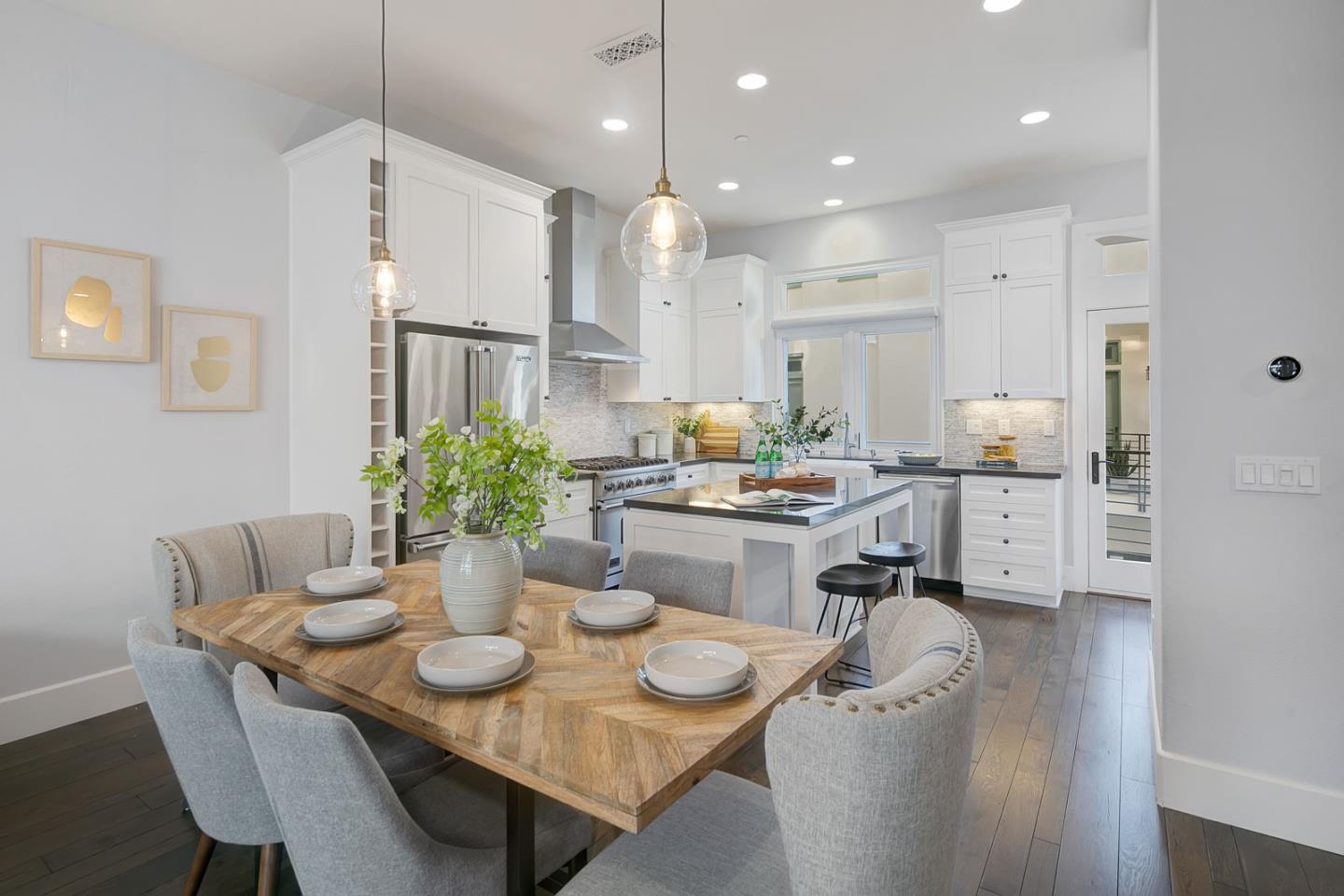 534 Fierro Loop Campbell, CA 95008 - Photo 16 of 55 a room with stainless steel appliances kitchen island granite countertop a dining table and chairs