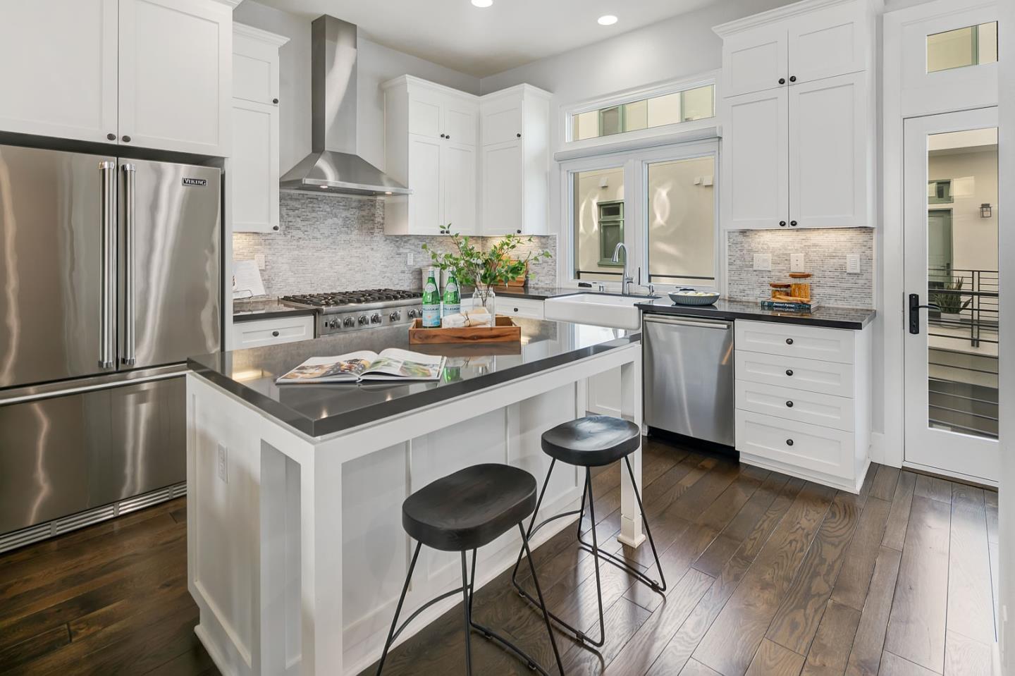 534 Fierro Loop Campbell, CA 95008 - Photo 17 of 55 a kitchen with granite countertop a sink stove and refrigerator