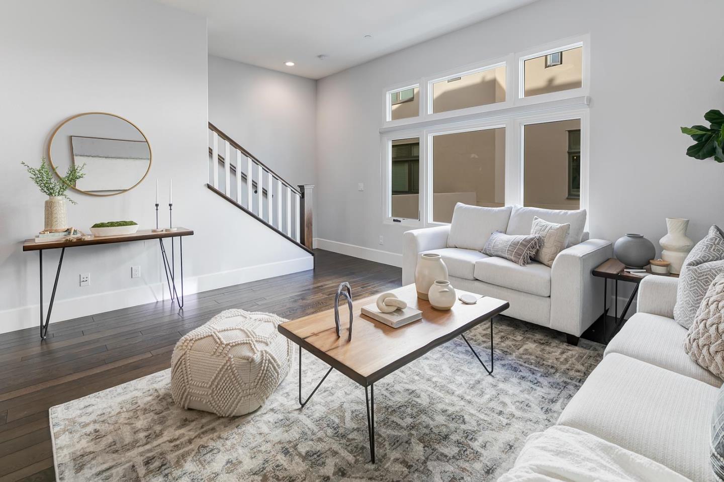534 Fierro Loop Campbell, CA 95008 - Photo 24 of 55 a living room with furniture a rug a lamp and a large window