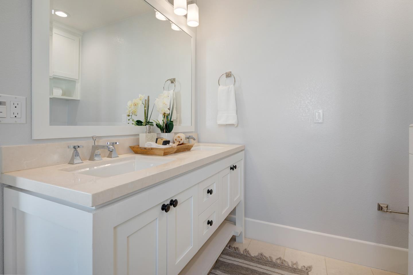 534 Fierro Loop Campbell, CA 95008 - Photo 31 of 55 a bathroom with a sink and a mirror