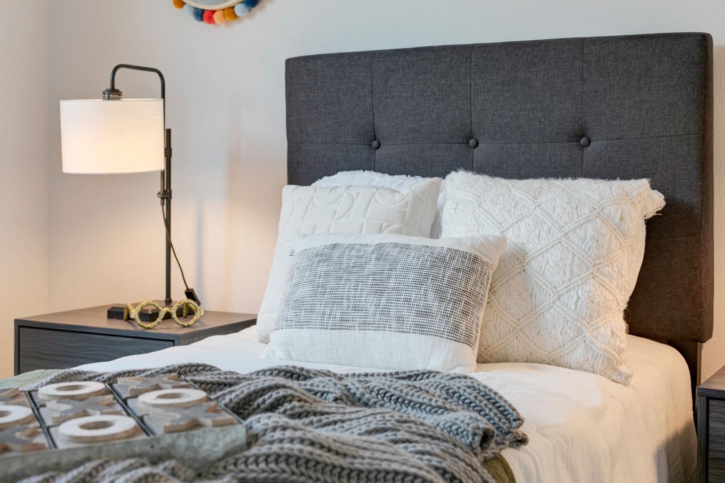 534 Fierro Loop Campbell, CA 95008 - Photo 38 of 55 a bed with a white comforter and pillows