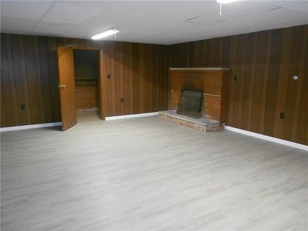 a view of an empty room with wooden door