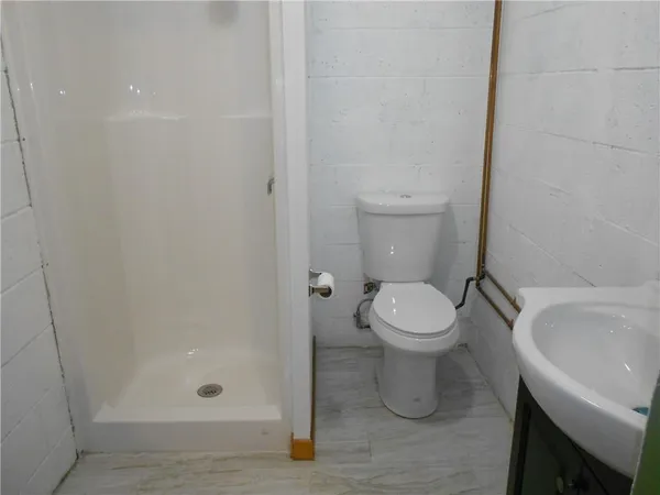 a bathroom with a toilet and a sink