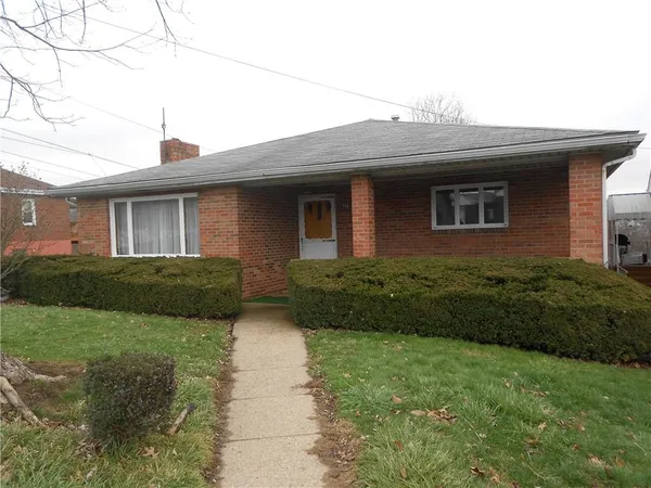 a front view of house with yard