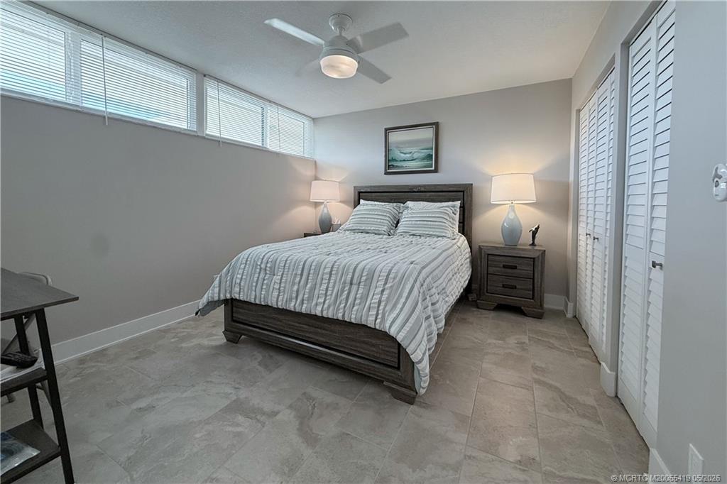 1950 Southwest Palm City Road, Unit 14305 Stuart, FL 34994 - Photo 45 of 70 a bedroom with a bed and a window