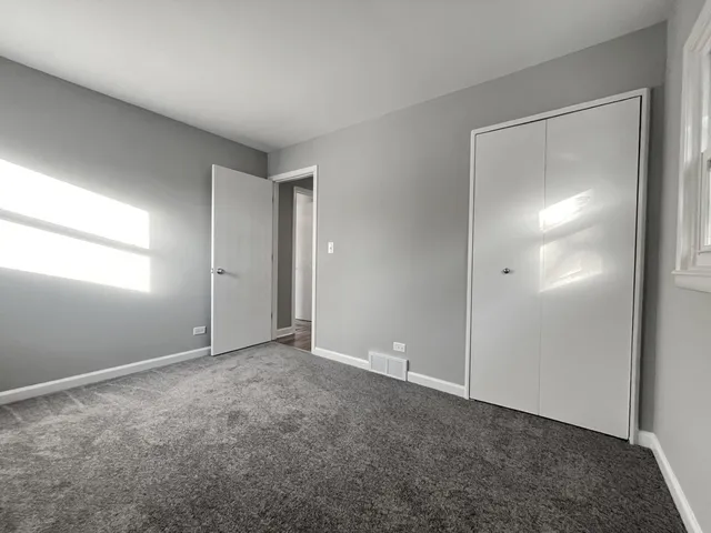a kitchen with wooden cabinets and a stove top oven
