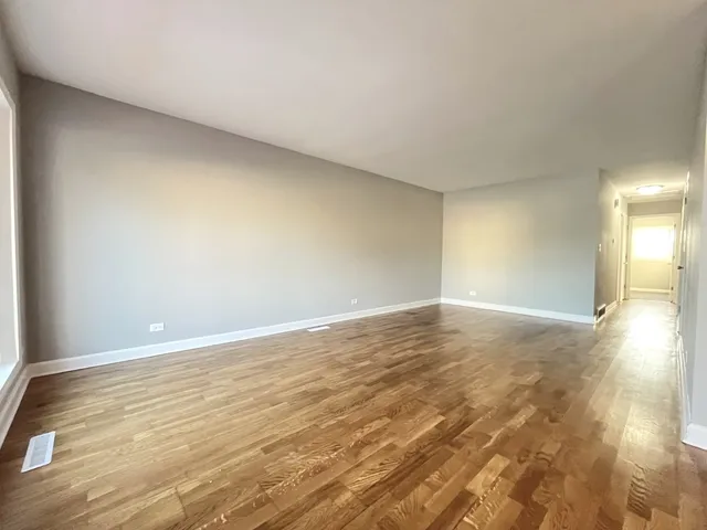 a view of an empty room and window