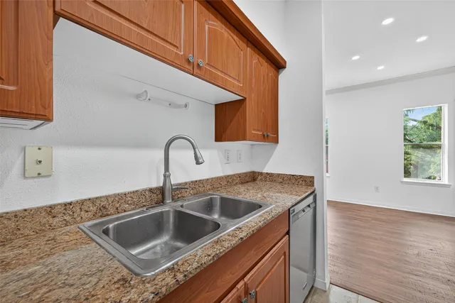 a kitchen with a sink and cabinets