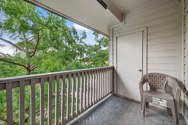 a view of balcony with furniture