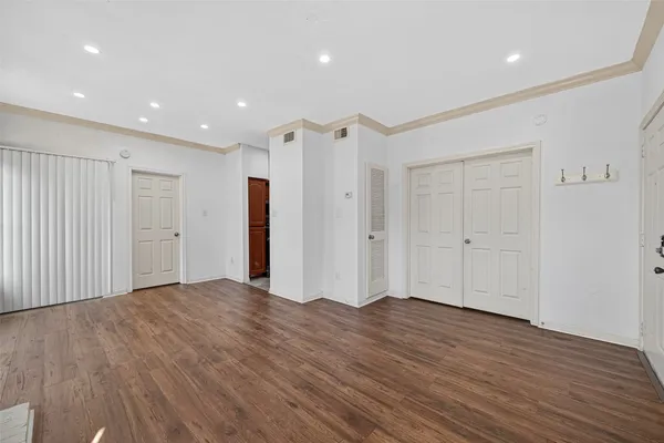 a view of a livingroom with wooden floor
