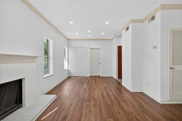 a view of livingroom with hardwood floor and hallway
