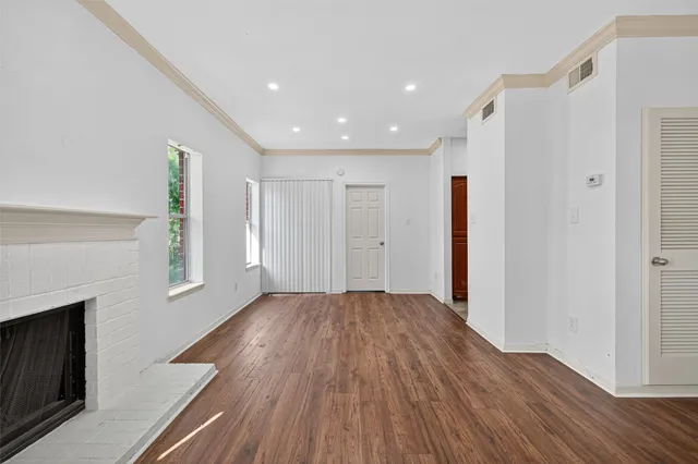 a view of livingroom with hardwood floor and hallway