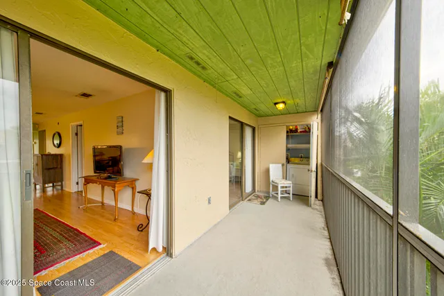 a view of balcony with furniture