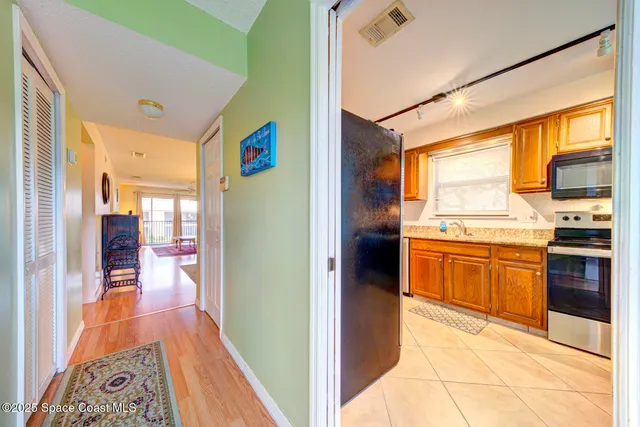 a view of a kitchen with a stove top oven