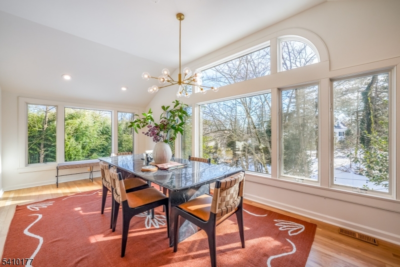 250 Old Short Hills Road Short Hills, NJ 07078 - Photo 8 of 38 a dining room with furniture a chandelier and wooden floor