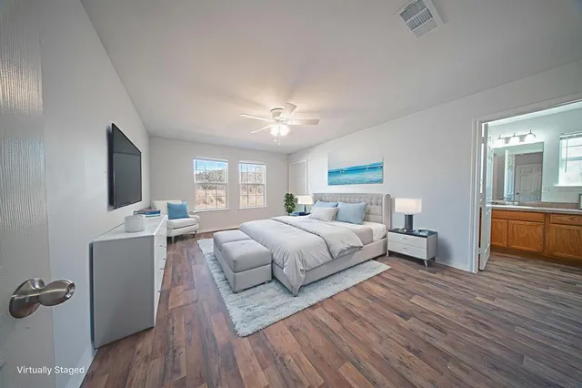 a bed room with bed and window