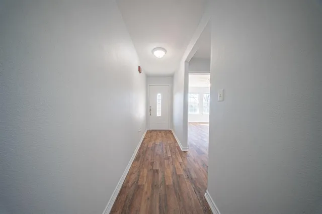 a view of entryway with wooden floor