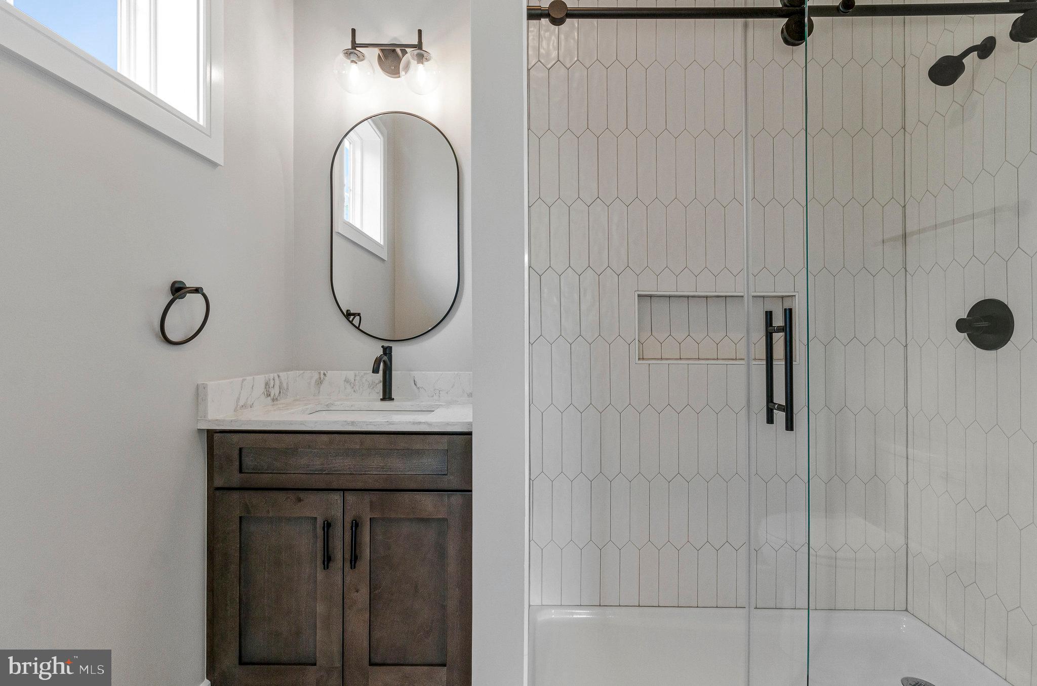 2300 Meridian Street Falls Church, VA 22046 - Photo 17 of 40 a bathroom with a sink and a mirror