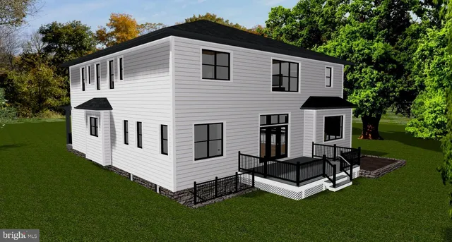 a view of a house with a yard and deck