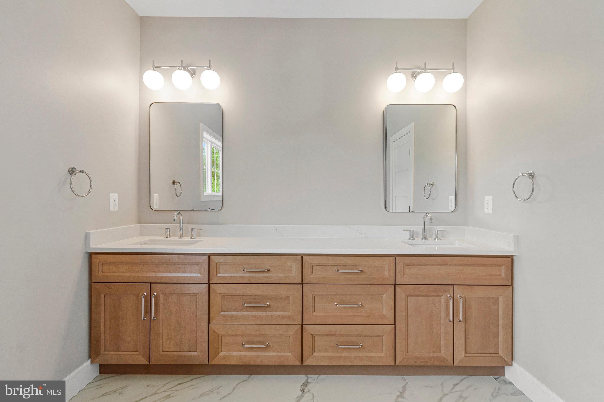 2300 Meridian Street Falls Church, VA 22046 - Photo 22 of 40 a bathroom with double vanity sinks and a mirror