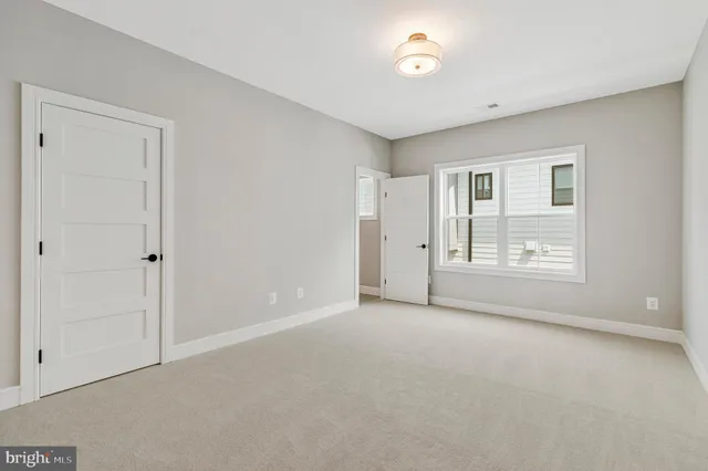 a kitchen with white cabinets and a sink