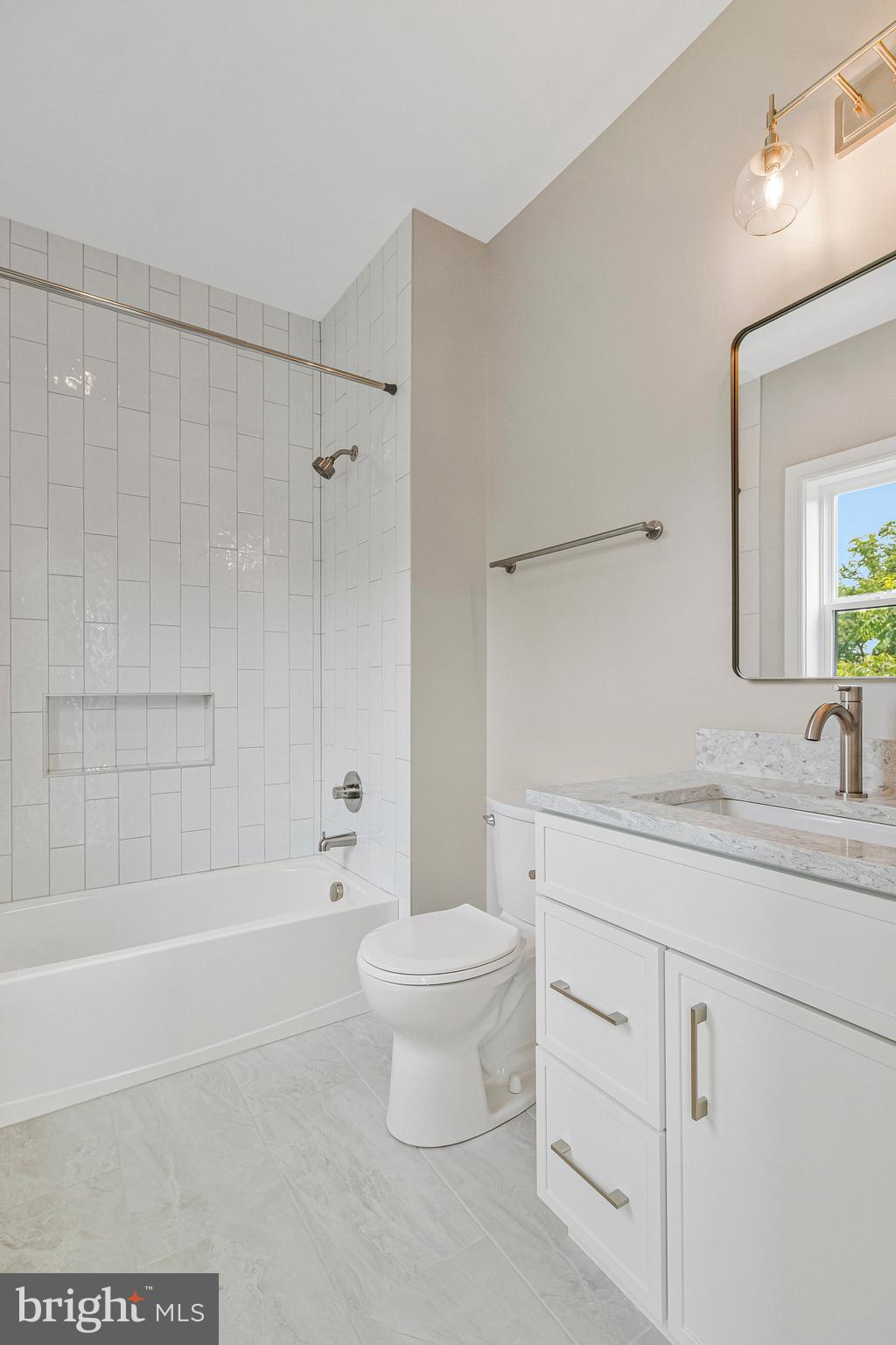 2300 Meridian Street Falls Church, VA 22046 - Photo 33 of 40 a bathroom with a granite countertop sink a toilet and shower