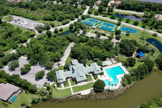 a view of a patio with a dining table and chairs