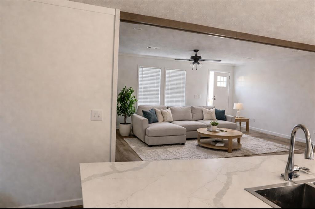 a living room with furniture and a window