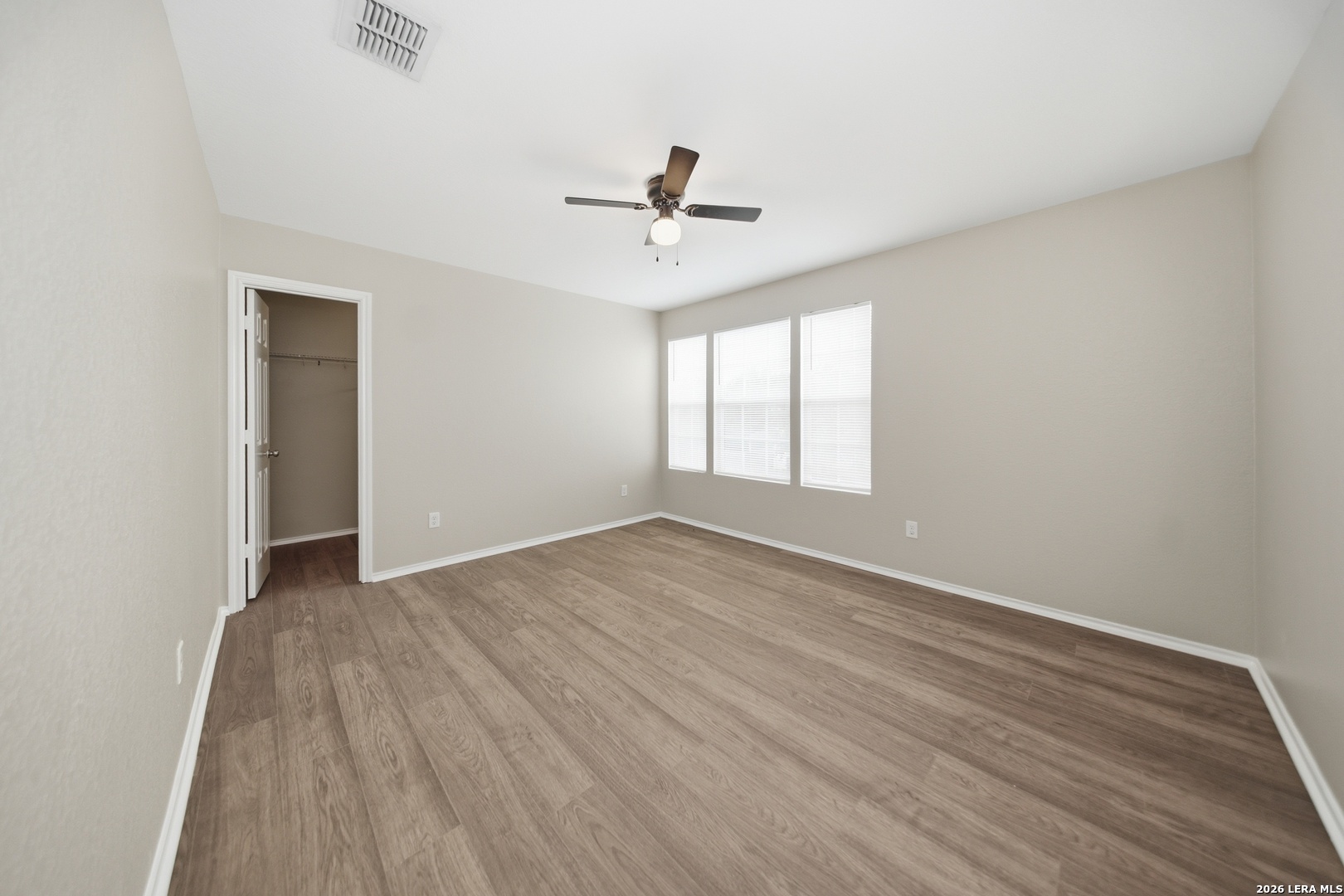 403 Walnut Crest Schertz, TX 78154 - Photo 23 of 30 wooden floor in an empty room with a window