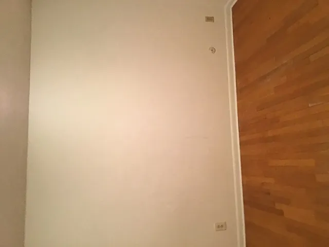 a view of a door and a window