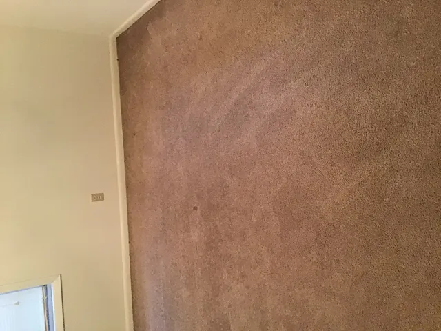 a view of a room that has a window in it