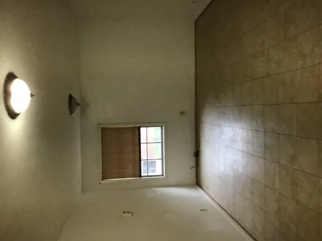 a bathroom with a shower and a mirror